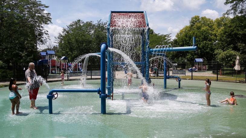 The splash pad at Island Park was a popular location on Thursday as the temperatures rose above 90 with high humidity. Residents from Dayton, Kettering and New Carlisle were there at noon. A high heat index is expected to last through Satruday, making work outdoors potentially dangerous for those not acclimated to it.  TY GREENLEES / STAFF