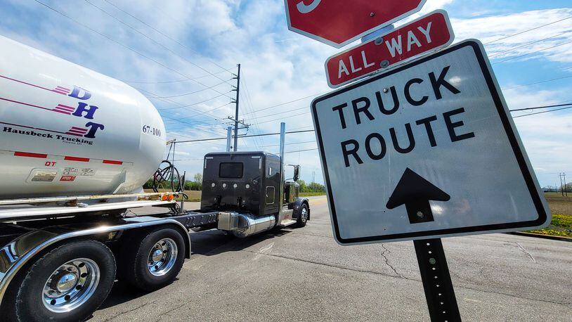 This truck driver follows the signs as he crosses over Yankee Road to Todhunter Road in Monroe. Residents say too many truck drivers disobey the signs. NICK GRAHAM/STAFF