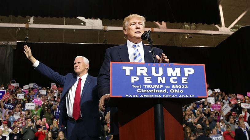 CLEVELAND, OH - OCTOBER 22: Vice Presidential candidate Mike Pence stands with Donald Trump during a rally on October 22, 2016 in Cleveland, Ohio.Trump continues to struggle in many swing states against his rival for the presidency Hillary Clinton. It is believed that Ohio is a must win state for Trump. (Photo by Spencer Platt/Getty Images)