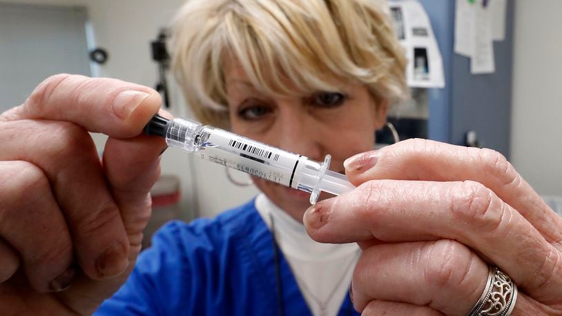 Health professionals say October is the start of flu season and recommend the public receive a flu shot. BILL LACKEY/FILE