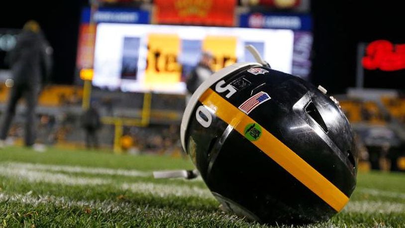 The helmet of Pittsburgh Steelers inside linebacker Ryan Shazier (50) sits on the field after an NFL football game between the Pittsburgh Steelers and the Baltimore Ravens in Pittsburgh, Monday, Dec. 11, 2017. Shazier suffered a spinal cord injury in last week's game and is recovering from surgery to stabilize his spine. The Steelers beat the Baltimore Ravens 39-38 to capture the AFC North Championship. (AP Photo/Keith Srakocic)