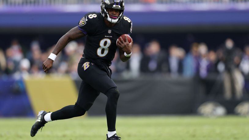 BALTIMORE, MD - NOVEMBER 18: Quarterback Lamar Jackson #8 of the Baltimore Ravens carries the ball in the first quarter against the Cincinnati Bengals at M&T Bank Stadium on November 18, 2018 in Baltimore, Maryland. (Photo by Patrick Smith/Getty Images)