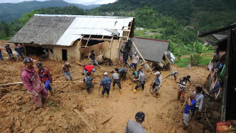Rescuers search for victims at a village hit by a landslide in Sirnaresmi, West Java on Tuesday.