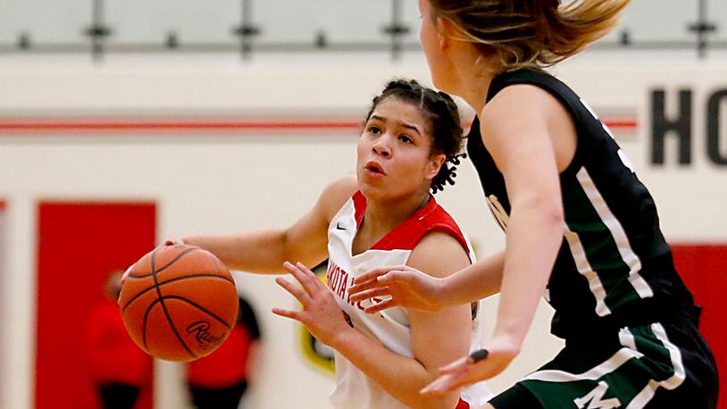 Lakota West High School guard Amara Flores drives to the basket against Mason forward Marilyn Popplewell-Garter during a game on Jan. 23, 2021. Flores scored 17 points in Wednesday's tournament triumph over Edgewood. JN FILE PHOTO