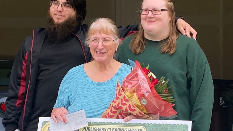Publisher's Clearing House surprised Fairborn resident Margaret Allgood (front) with a $10,000 check on September 15. She is shown with (back row L-R) with nephew Jake Seaborn and his fiance, Cozette Guillory, who live with Allgood.