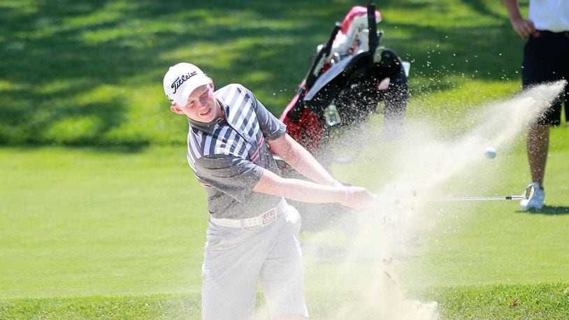 Maxwell Moldovan of Uniontown hits a bunker shot on the 18th hole in the final round of the 113th Ohio Amateur on Friday at Moraine Country Club. The Ohio State recruit fired a final-round 69 to edge Scott Anderson of Columbus by one shot to win the title. John Boyle/STAFF
