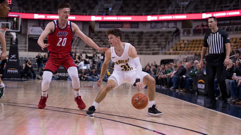 Wright State’s Cole Gentry is guarded by UIC’s Jamie Ahale during Monday’s Horizon League semifinal at Indiana Farmers Coliseum in Indianapolis. Joseph Craven/WSU Athletics