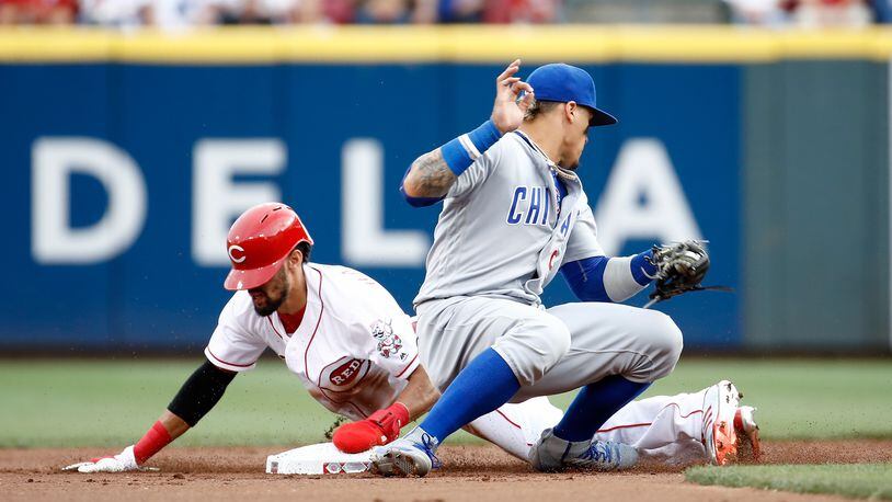CINCINNATI, OH - AUGUST 22: Billy Hamilton #6 of the Cincinnati Reds slides safely into second base for a stolen base ahead of the tag by Javier Baez #9 the Chicago Cubs at Great American Ball Park on August 22, 2017 in Cincinnati, Ohio. (Photo by Andy Lyons/Getty Images)