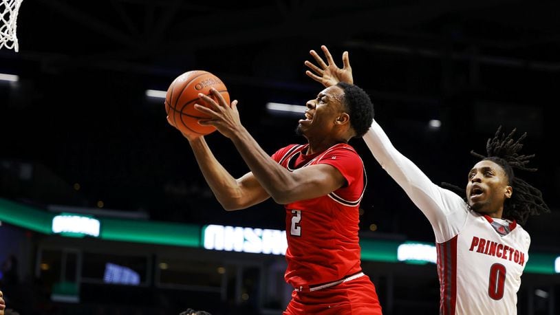 Fairfield's DeShawn Crim goes to the basket defended by Princeton's Illijah Adams during their Division I regional semifinal basketball game Wednesday, March 8, 2023 at Xavier University's Cintas Center. Fairfield won 51-45. NICK GRAHAM/STAFF