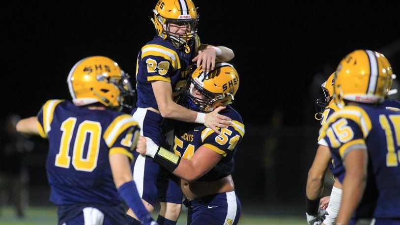 Springfield's Kraeton Muenchau (54) celebrates a field goal by Cole Yost against Centerville on Friday, Oct. 8, 2021, in Springfield. David Jablonski/Staff