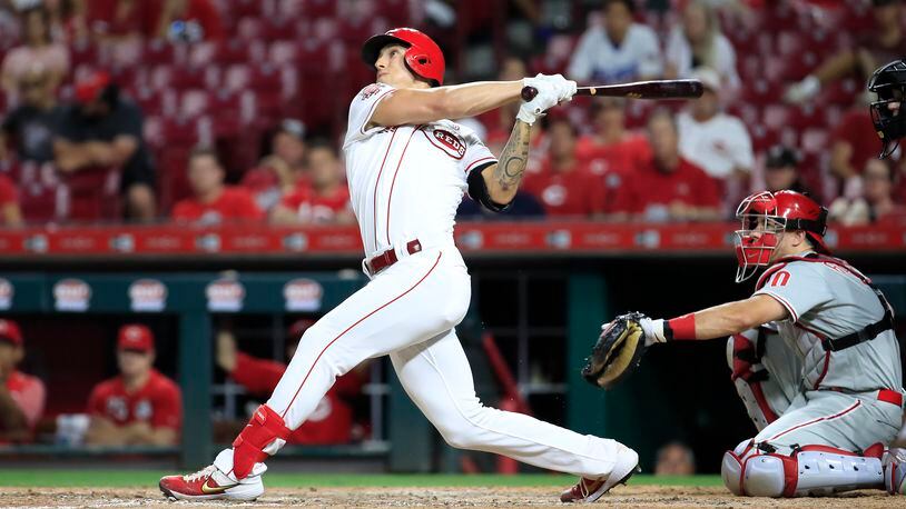 CINCINNATI, OHIO - SEPTEMBER 04:  Michael Lorenzen #21 of the Cincinnati Reds hits a two run home run in the 8th inning against the Philadelphia Phillies at Great American Ball Park on September 04, 2019 in Cincinnati, Ohio. (Photo by Andy Lyons/Getty Images)