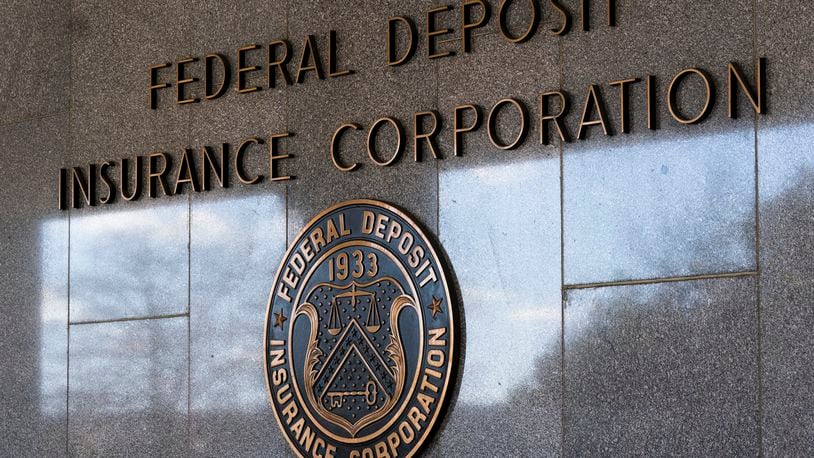 FILE - The Federal Deposit Insurance Corporation (FDIC) seal is shown outside its headquarters, March 14, 2023, in Washington. An independent review released Tuesday, May 7, 2024, of the Federal Deposit Insurance Corp. 's workplace culture describes an environment that fostered “hostile, abusive, unprofessional, or inappropriate conduct," and questions whether the agency's chairman is credible to lead the agency through a cultural transformation. (AP Photo/Manuel Balce Ceneta, File)