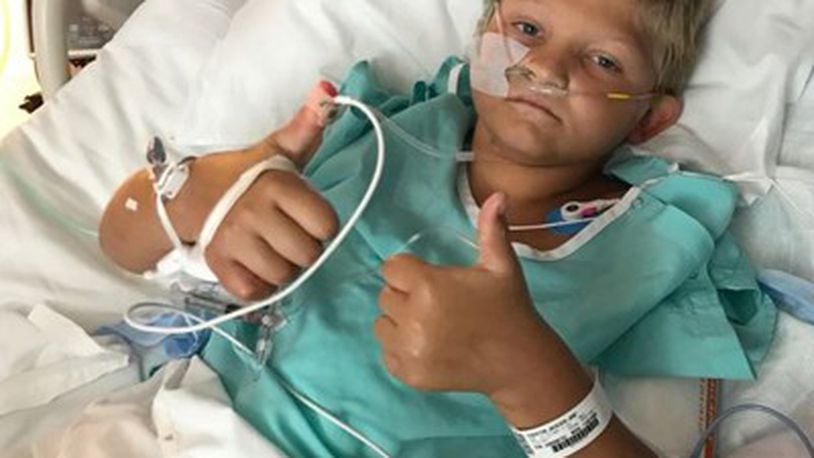 Jackson “Jack” Loyd, 9, is still recovering at Cincinnati Children’s Hospital Medical Center after he fell July 21 from the roof of a trailer onto a trampoline. CONTRIBUTED