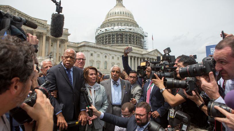 WASHINGTON, DC - JUNE 23: Rep. John Lewis (D-GA), left, Minority Leader Nancy Pelosi (D-CA), center, and Charles Rangel, (D-NY), right, speak with supporters outside the U.S. Capitol building June 23, 2016 in Washington, DC. Democratic House members ended their overnight House floor sit-in trying to force a vote on gun control legislation. (Photo by Allison Shelley/Getty Images)