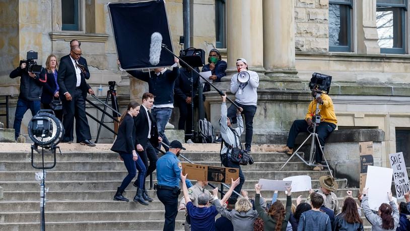Markus Cook, a native of Butler County, is filming the sequel to his 2019 film Alan and the Fullness of Time. This sequel, titled "Alan and the Rules of the Air" will be shot in Hamilton, Covington, Ky., and various parts of the Cincinnati region. These scenes were shot at the historic Butler County Courthouse Monday, Feb. 21, 2022 in Hamilton. NICK GRAHAM/STAFF