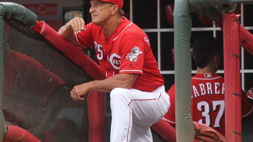 Reds bench coach Jim Riggleman watches from the dugout during a game against the Marlins on Thursday, Aug. 18, 2016, at Great American Ball Park in Cincinnati. David Jablonski/Staff