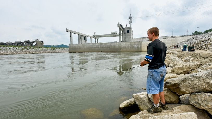 The city of Hamilton owns three hydroelectric power plants, including the 105-megawatt Meldahl Hydroelectric Plant near Foster, Ky., where Brandon Blackburn, 17, fished during its 2016 dedication ceremony. Now, Hamilton is allowing residential customers to use solar power and sell it to the city’s electric system. NICK GRAHAM/STAFF