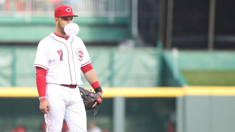 Reds third baseman Eugenio Suarez blows a bubble on April 3, 2017, during a game against the Phillies at Great American Ball Park.