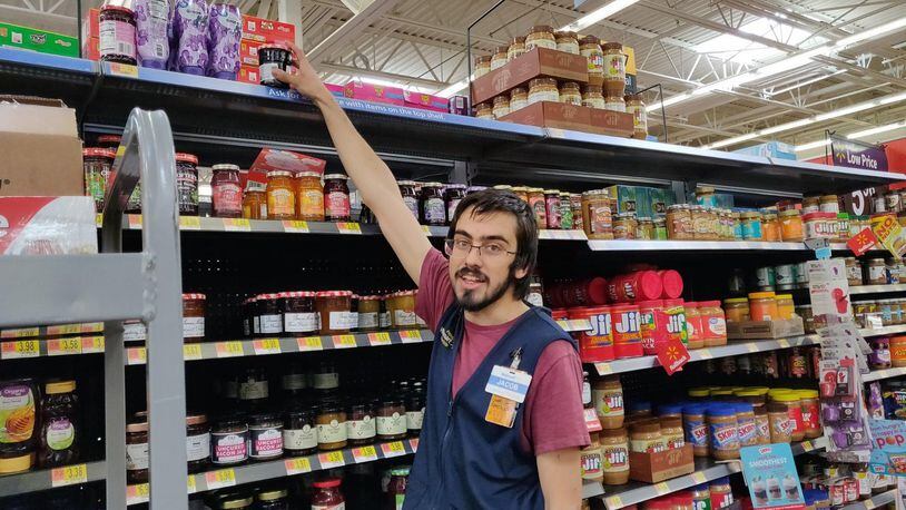 Jacob Cotton, 21, works at Walmart. He’s participating in the Live Better U education program that offers several college degrees for $1 per day.