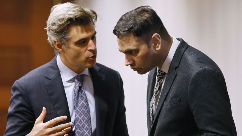 Defense attorney Charles M. Rittgers, left, talks with his client, Gurpreet Singh, during a motions hearing. The jury trial of Gurpreet Singh, charged with allegedly shooting and killing four family members in 2019 in West Chester Township, started with preliminary motions and jury selection Monday, Oct. 3, 2022 in a new super courtroom in Butler County Common Pleas Court in Hamilton. NICK GRAHAM/STAFF