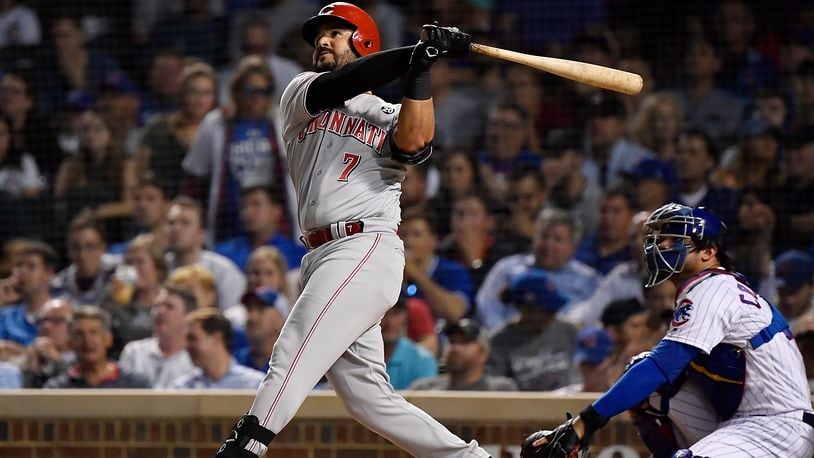 CHICAGO, ILLINOIS - SEPTEMBER 18: Eugenio Suarez #7 of the Cincinnati Reds hits a home run in the fourth inning against the Chicago Cubs at Wrigley Field on September 18, 2019 in Chicago, Illinois. (Photo by Quinn Harris/Getty Images)