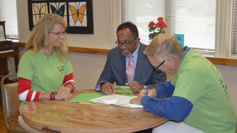 Signing the Memorandum of Understanding between Miami University and Oxford Seniors Monday were, from left, Renate Crawford, Michael Dantley and Rich Bement. CONTRIBUTED/BOB RATTERMAN