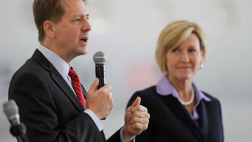 Candidate for Ohio governor Richard Cordray is shown with his running mate, Betty Sutton, during a Dayton Chamber of Commerce meeting on Thursday, Aug. 16. TY GREENLEES / STAFF