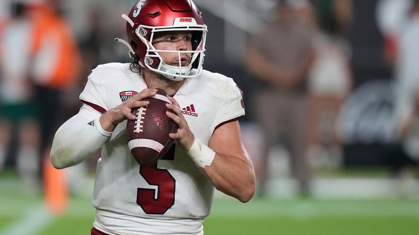 Miami (Ohio) quarterback Brett Gabbert looks for an open teammate during the second half of an NCAA college football game against Miami, Friday, Sept. 1, 2023, in Miami Gardens, Fla. (AP Photo/Wilfredo Lee)