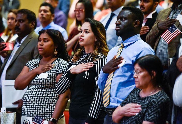 Nearly 100 people become U.S. citizens at naturalization ceremony at Miami Hamilton