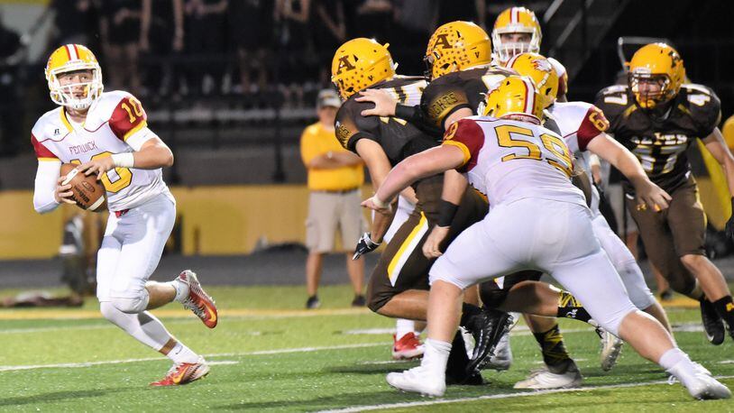 Fenwick quarterback Sully Janeck (10) is under pressure from the Alter defense last Friday night at Centerville Stadium. Janeck threw two touchdown passes, but the Falcons lost 45-20. CONTRIBUTED PHOTO BY ANGIE MOHRHAUS