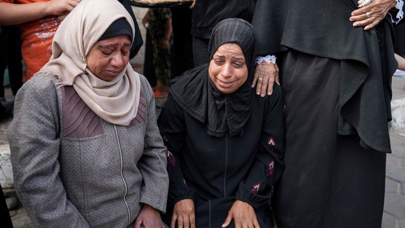 Mourners react next to the bodies of Palestinians who were killed in an Israeli airstrike in Gaza Stirp, at the Al Aqsa hospital in Deir al Balah, Gaza, Thursday, May 2, 2024. (AP Photo/Abdel Kareem Hana)