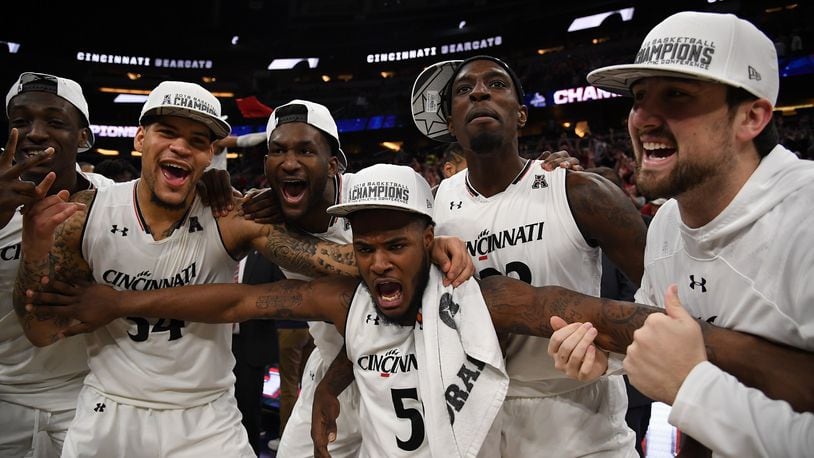 The Cincinnati Bearcats celebrate their championship over Houston Cougars at the final game of the 2018 AAC Basketball Championship at Amway Center on March 11, 2018 in Orlando, Florida. (Photo by Mark Brown/Getty Images)