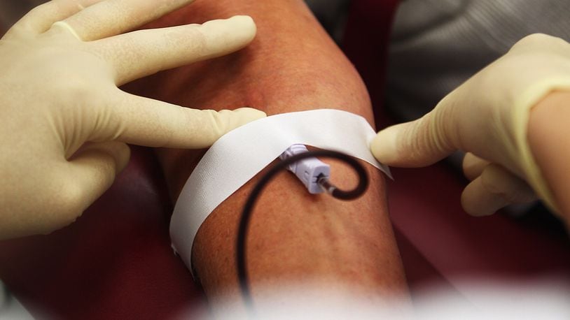 A person donates blood. James Harrison of Australia (not pictured) is retiring after donating blood on a weekly basis for decades. (Photo by Joern Pollex/Getty Images)