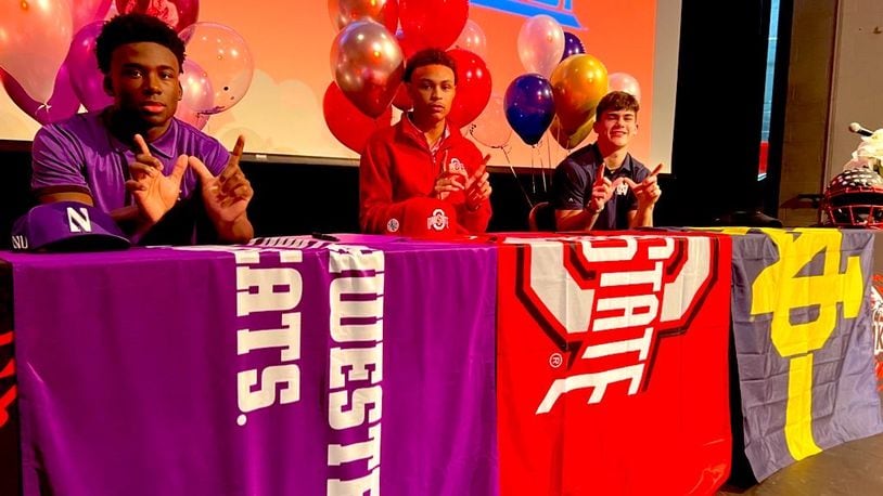 From left, Lakota West seniors Joshua Fussell (Northwestern), Malik Hartford (Ohio State) and Ben Minich (Notre Dame) signed letters of intent on National Signing Day on Dec. 21, 2022. Chris Vogt/CONTRIBUTED