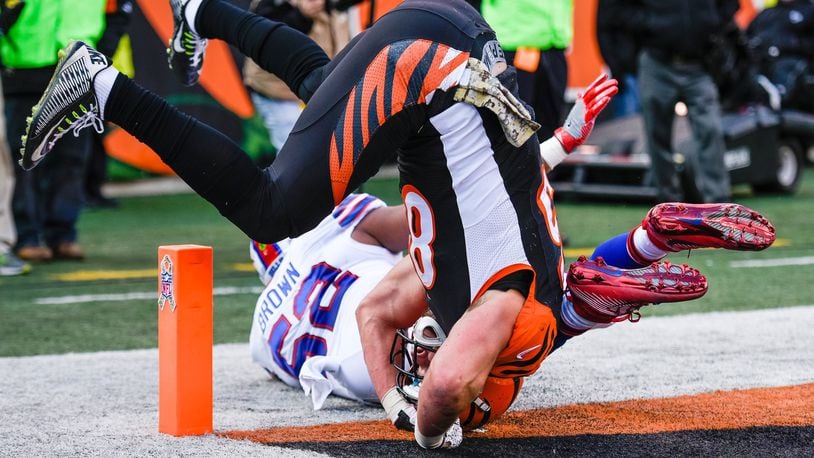 Cincinnati Bengals tight end Tyler Eifert gets inverted as he misses a pass defended by Buffalo Bills linebacker Preston Brown during their 16-12 loss to the Buffalo Bills in the 2016 season at Paul Brown Stadium in Cincinnati. NICK GRAHAM/STAFF