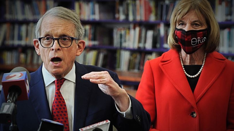 Gov. Mike DeWine addresses the media after touring a COVID-19 vaccination clinic at Thurgood Marshall High school in Dayton on Sunday. / Staff photo by Marshall Gorby