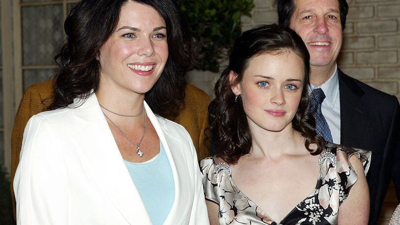 BURBANK, CA - JANUARY 31: Actors Lauren Graham (L), Alexis Bledel and WB's Peter Roth pose poses at The WB Networks 'The Gilmore Girls' 100th episode celebration on the set at Warner Bros. Studios on January 31, 2005 in Burbank, California. (Photo by Kevin Winter/Getty Images)