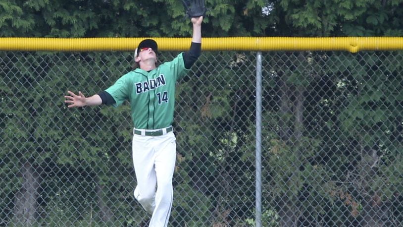 Badin outfielder Alex Holderbach (14) catches a deep fly ball during a game against Hamilton at Alumni Field in Hamilton on May 9, 2015. GREG LYNCH/STAFF