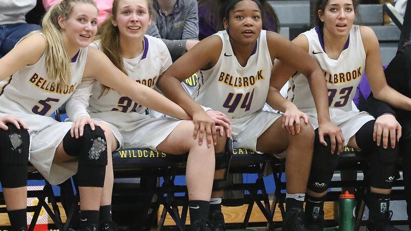 Members of the Bellbrook girls basketball team watch from the bench as a member of their team sinks a free throw to clinch the regional final victory over Tipp last Friday at Springfield. Bill Lackey/Staff
