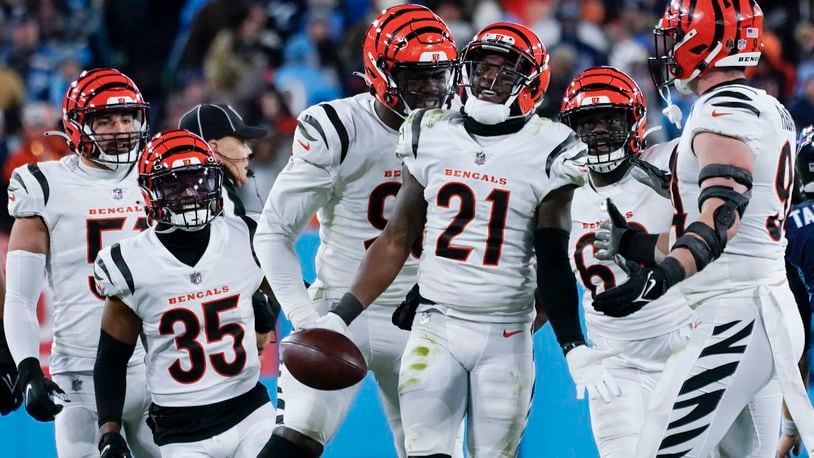 Cincinnati Bengals cornerback Mike Hilton (21) celebrates and interception he made against Tennessee Titans quarterback Ryan Tannehill (17) during the second half of an NFL divisional round playoff football game, Saturday, Jan. 22, 2022, in Nashville, Tenn. (AP Photo/Mark Humphrey)
