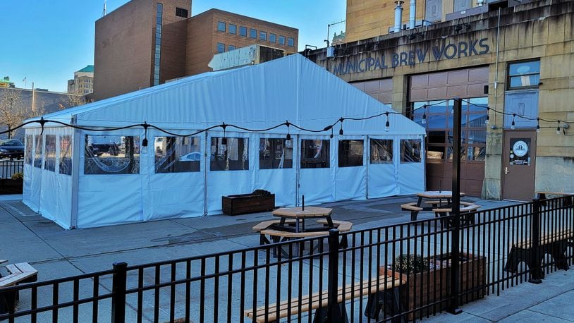 Municipal Brew Works hopes its new heated tent and award-winning hard seltzer will be key to attracting customers during the cold winter months. NICK GRAHAM / STAFF