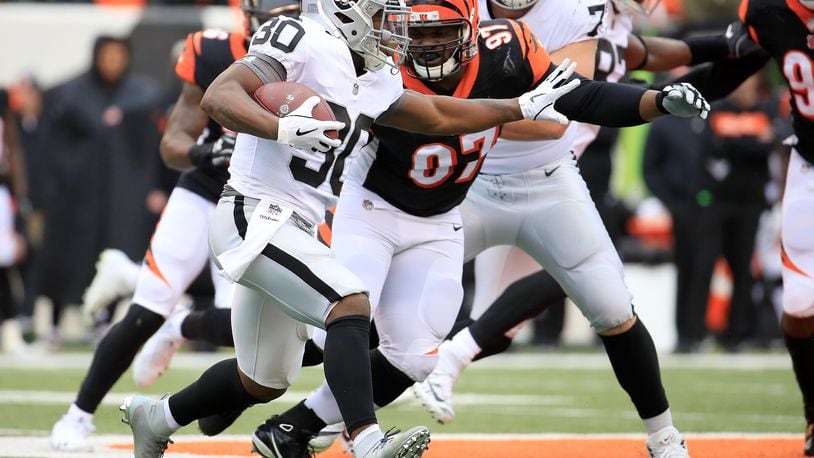 CINCINNATI, OH - DECEMBER 16: Jalen Richard #30 of the Oakland Raiders attempts to run the ball past Geno Atkins #97 of the Cincinnati Bengals during the first quarter at Paul Brown Stadium on December 16, 2018 in Cincinnati, Ohio. (Photo by Andy Lyons/Getty Images)