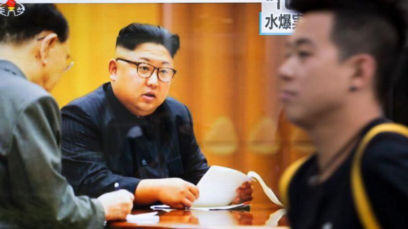 A monitor shows an image of North Korean leader Kim Jong-Un during a news program .