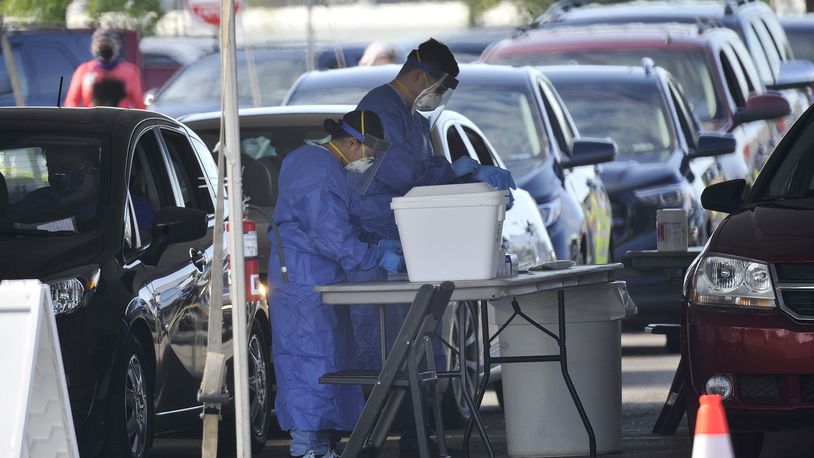 Dayton Daily News file photo of COVID-19 testing being conducted in July 2020. A new report released by the CDC on Aug. 23, 2022, showed the life expectancy in the U.S. has gone down in all 50 states, plus D.C., due to the pandemic, along with drug overdose deaths. STAFF