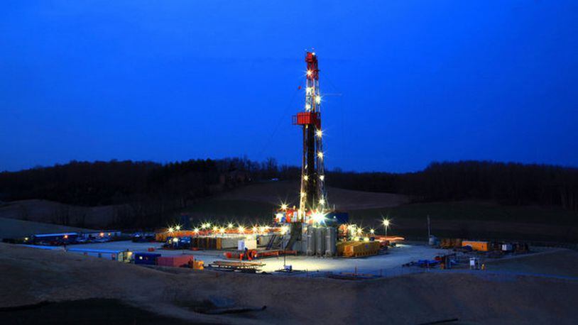 A drilling rig stands lit in Carroll County in 2013 when there was talk of an unstoppable shale “boom” in Ohio. Natural gas from shale wells was increasing at the time. The Plain Dealer