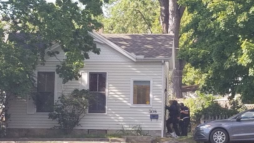 A SWAT team surrounded a Hamilton residence in the 300 block of Wayne Avenue shortly after 5 p.m. today. MICHAEL PURVES/STAFF