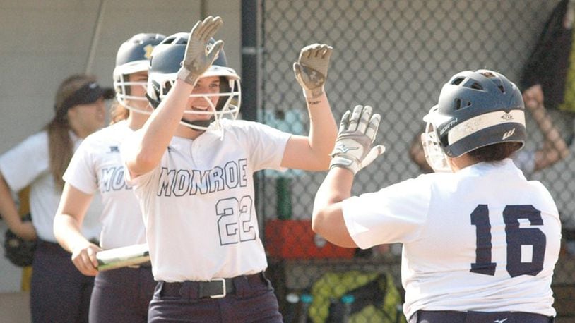 Monroe’s Sam Schwab (22) and Makenzi Moore (16) high-five April 30 during a 1-0 victory over Brookville in Southwestern Buckeye League Southwestern Division play. RICK CASSANO/STAFF