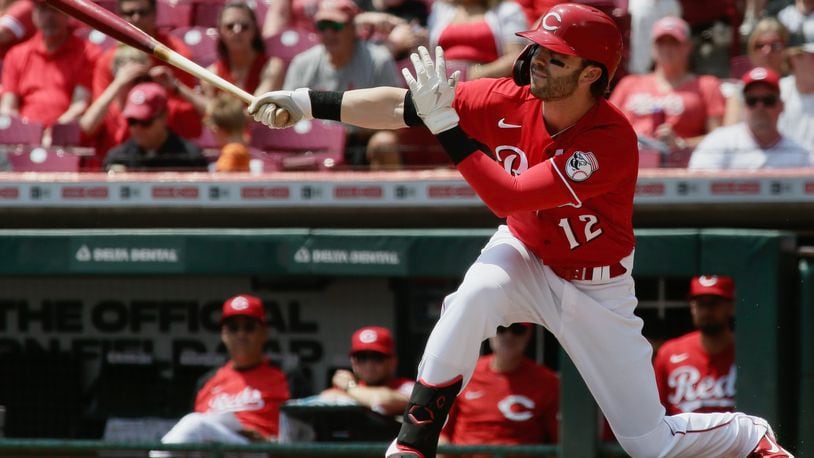 Tyler Naquin, of the Reds, triples with the bases loaded in the first inning against the Brewers on Wednesday, May 11, 2022, at Great American Ball Park in Cincinnati. David Jablonski/Staff