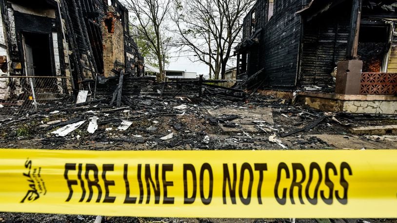 An early morning fire destroyed three homes in the 600 block of Ludlow street Wednesday, May 6, 2020 in Hamilton. NICK GRAHAM / STAFF