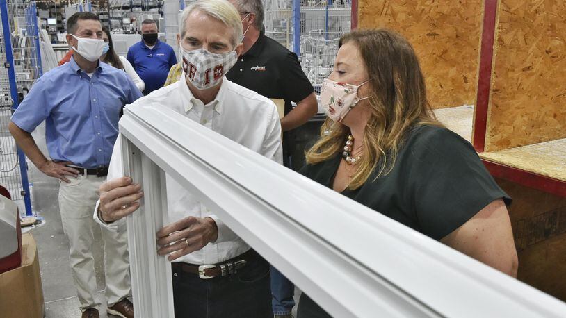 U.S. Sen. Rob Portman, R-Cincinnati, talks with Vinylmax Windows president Laura Doeger-Roberts as he tours the Hamilton plant Monday, August 31, 2020. Vinylmax is one of the local business who received a payroll protection program loan to keep their employees on payroll during the COVID-19 pandemic. NICK GRAHAM / STAFF